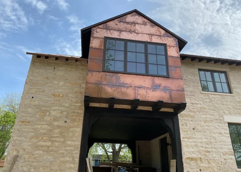 Copper metal panel facade on a stone building for Metal Roof Coating in Anaheim