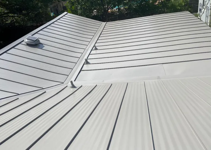 Solar attic fan installed on a metal roof for Roof Ventilation in Anaheim